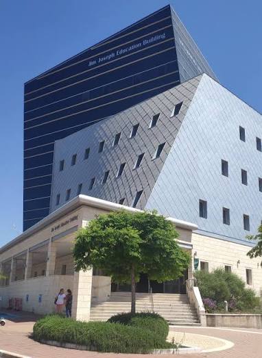 Distinctive stone and glass building on the Bar-Ilan University campus